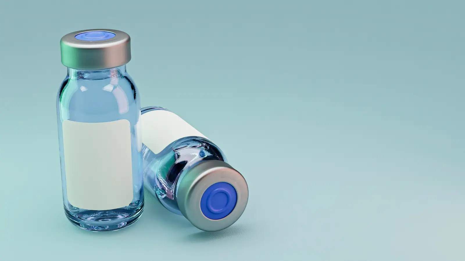 Two glass medicine vials with blank labels